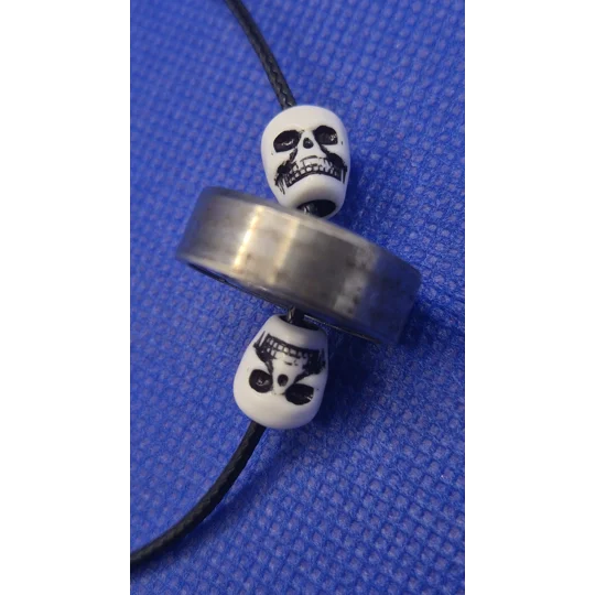 Skateboard Bearing and Skull on black cord necklace A rad piece from Xhale