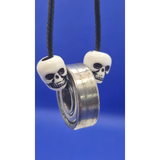 Skateboard Bearing and Skull on black cord necklace A rad piece from Xhale