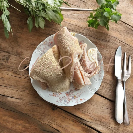 A white plate containing cow(beef) tripe (shaki)