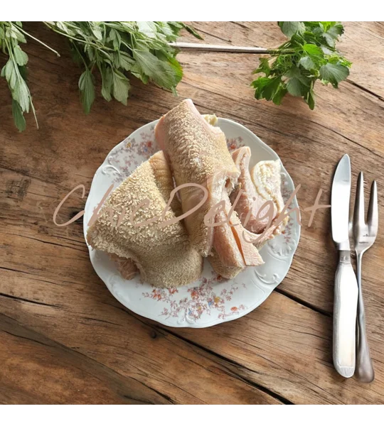 A white plate containing cow(beef) tripe (shaki)