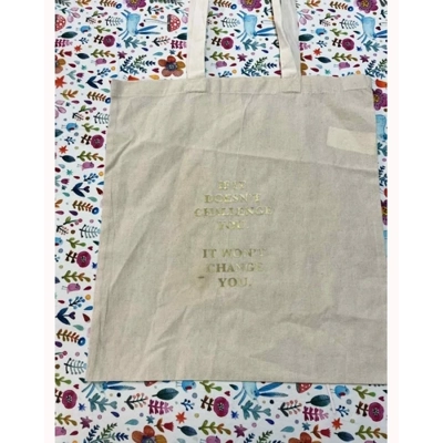 if it doesn't challenge you tote bag
