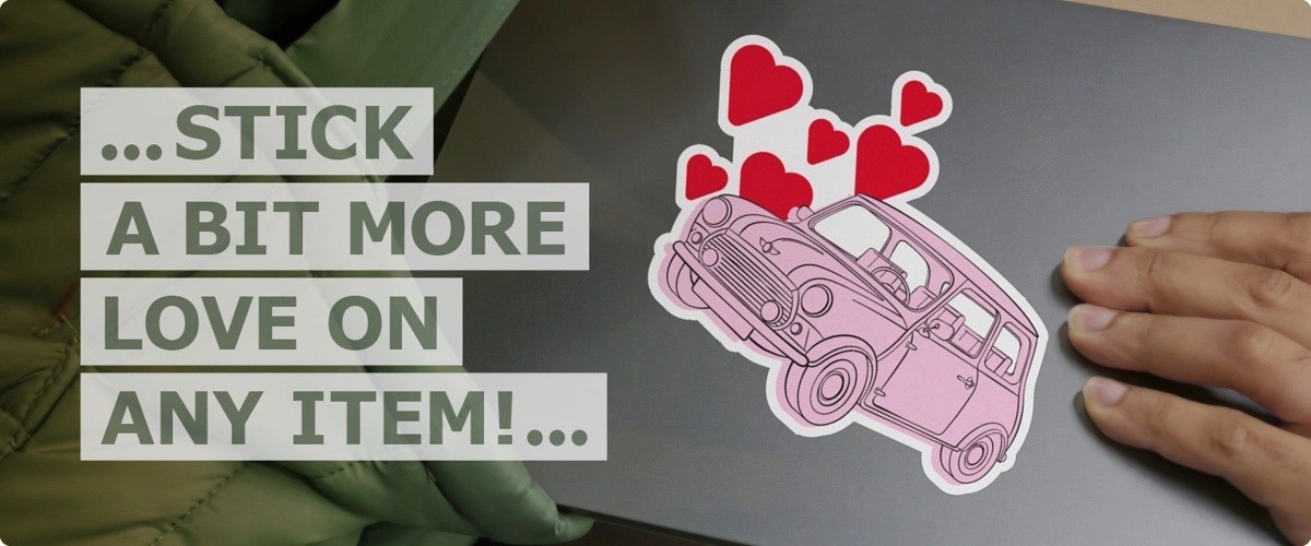 Hand pulling closed laptop from bag with Mini Love design sticker on cover next to text wording that reads ‘stick a bit more love on any item’.