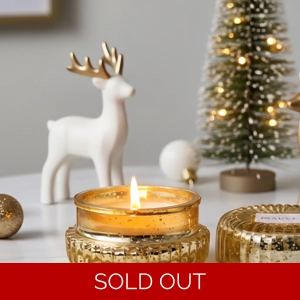 Christmas candle in gold macaron jar