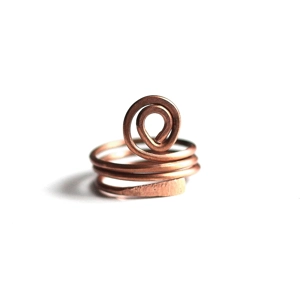 This is a bold spiral statement ring to adorn to your hand. I've hand forged this ring out of pure copper wire. One end has been hammered flat and textured, the other end is a curved bold spiral. 

MEASUREMENTS: Ring is a size 7 and measures approximately 3/4″ from knuckle to knuckle.

~~ The spiral symbol has many cultural meanings, including spiritual growth, the cycle of life. It is also found in nature – flower petals, snail shells and weather patterns.