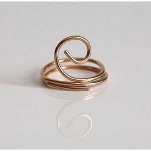 I forged this big swirl/spiral ring out of bronze wire; it's lightweight and cosy to wear. This is a simple, understated statement ring for you to wear.

Bronze, which is mostly made of copper and tin, has a lovely warm golden hue. 

MEASUREMENTS: Ring is size 7 1/2. It measures 5/8