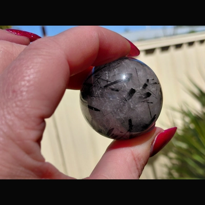 High quality black rutilated quartz sphere