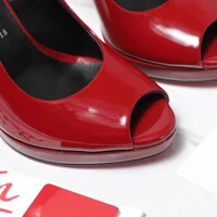 Christian Louboutin Lady Peep 150 pumps crafted in glossy red patent leather.