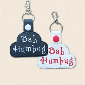 Black and white Bah Humbug Christmas keyrings with embroidered wording, snap fasteners, split rings and lobster clasps