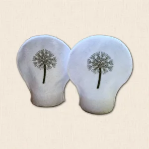 Pair of white felt Dandelion Tealight Covers with delicate embroidered seed heads shown unlit