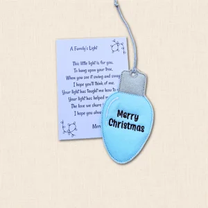 Family Christmas Light Bulb Decoration in pale blue felt with ‘Merry Christmas’ embroidery, hanging loop and sentimental poem card