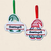 Male and female Greetings Gnome Christmas decorations embroidered on felt with festive red and green details and hanging ribbons