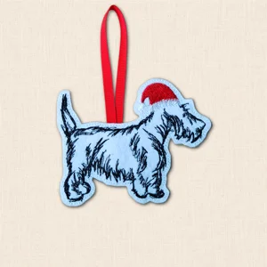 Scottish Terrier Christmas decoration embroidered on pale felt with detailed black Scottie stitching, red Santa hat and red hanging ribbon