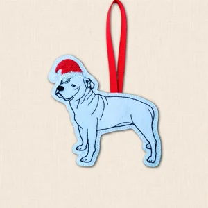 Staffordshire Bull Terrier Christmas decoration embroidered on pale felt with black outline detail, red Santa hat and red hanging ribbon