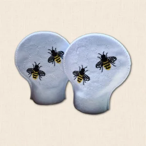 Pair of white felt Honey Bee tealight covers with embroidered bees and subtle honeycomb stitching