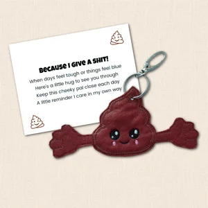 Embroidered Poop Pocket Pal with open arms beside a funny supportive keepsake card reading Because I Give A Shit