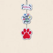 Three-part felt wall hanger with a bone-shaped 'Welcome' sign, colourful 'Wipe Your Paws!!' panel and large red paw print, joined with metal ball chain.