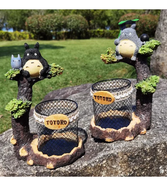 Cartoon tree branch resin pen holder in black or grey for desktop stationery organization and whimsical home office decoration.