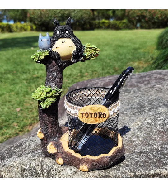 Cartoon tree branch resin pen holder in black or grey for desktop stationery organization and whimsical home office decoration.
