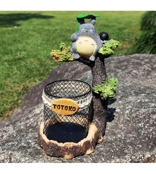 Cartoon tree branch resin pen holder in black or grey for desktop stationery organization and whimsical home office decoration.