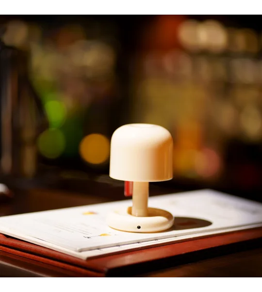 Mini rechargeable sunset night light with compact PC housing and USB charging for romantic bedroom atmosphere and desktop decoration.
