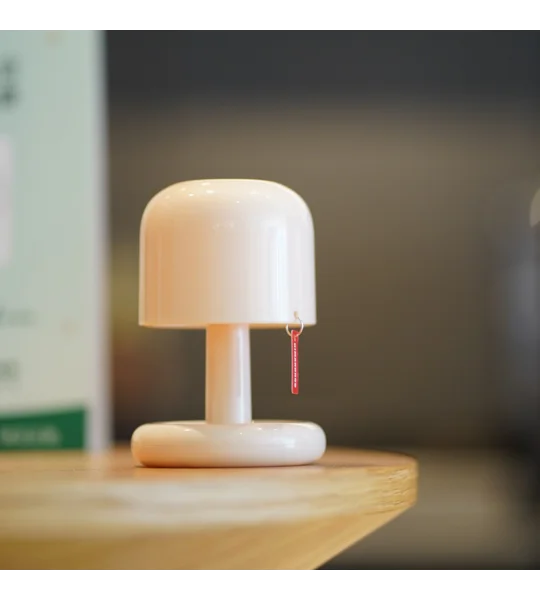 Mini rechargeable sunset night light with compact PC housing and USB charging for romantic bedroom atmosphere and desktop decoration.