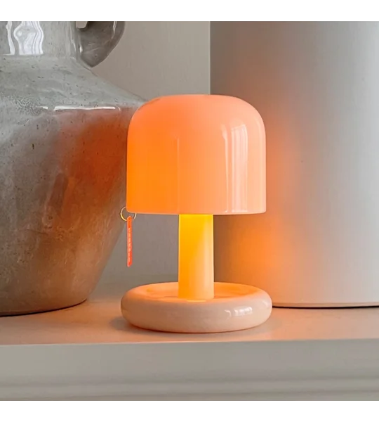 Mini rechargeable sunset night light with compact PC housing and USB charging for romantic bedroom atmosphere and desktop decoration.