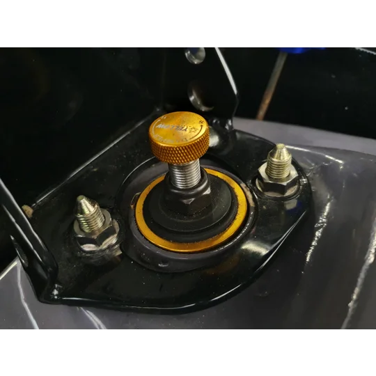 Exoracing titanium strut top nut fitted to Honda suspension tower