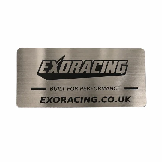 Brushed stainless steel Exoracing logo plate supplied with the weldable exhaust heat shield kit