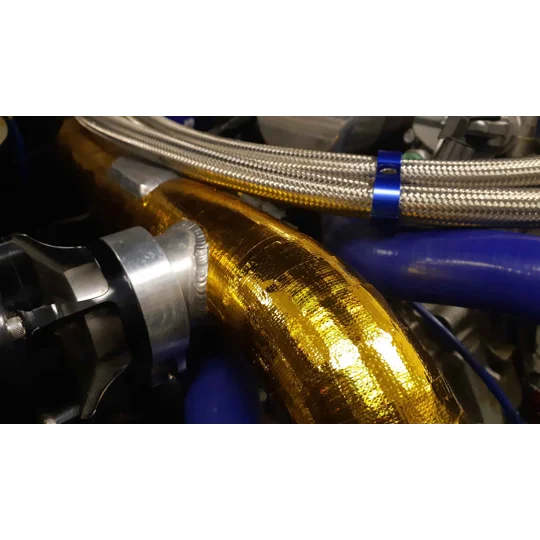 Reflective heat sheet protecting panel near turbo heat