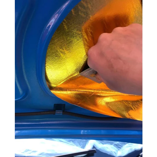 Cutting adhesive heat reflective sheet to shape