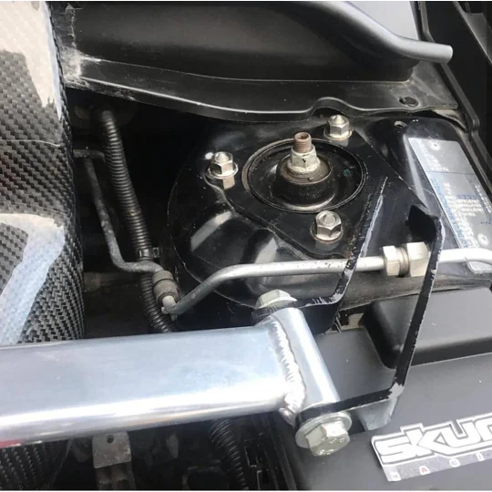 Exoracing titanium strut top nut fitted to Honda suspension tower