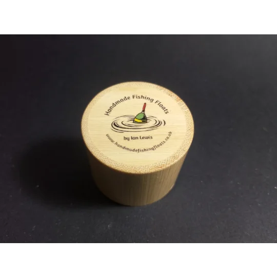 personalized bamboo float tube lid showing handmade fishing floats by Ian Lewis company logo