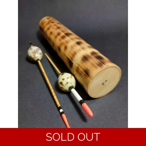 Handcrafted bamboo gift tube containing two real quail egg floats — premium handmade fishing floats for Christmas