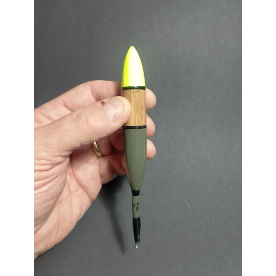 Balsa chubber 7ssg being held for scale