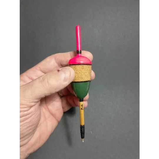 handmade traditional Cork pike float being held for scale