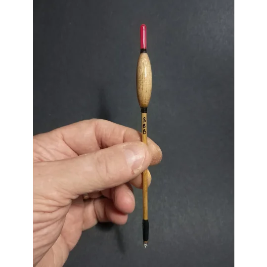 Handmade 4BB Billy Lane replica Avon fishing float held in hand to show size and scale.