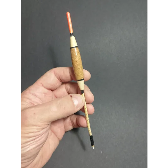 Handmade Signature Avon fishing float with balsa and cork body, held in hand to show size and scale