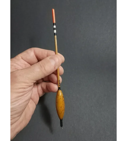 handmade loaded waggler 5bb float being held to demonstrate the size and scale of the float