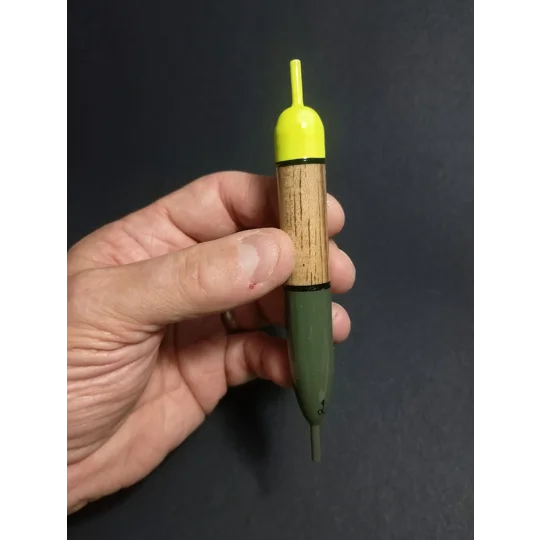 15g American inline pike slider float held in hand to show size and scale