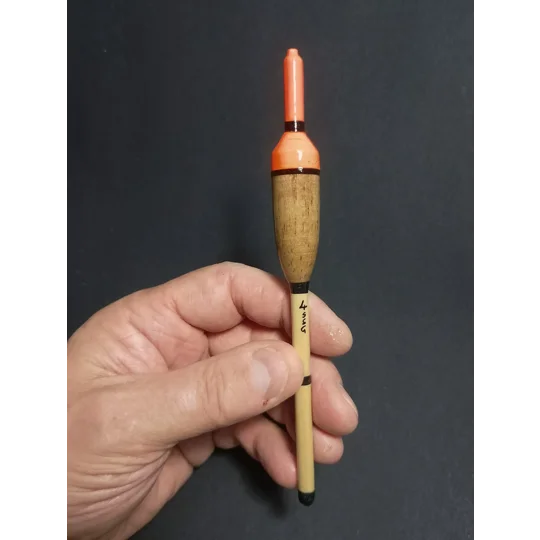 handmade inline perch bob float being held to demonstrate the size and scale of the float