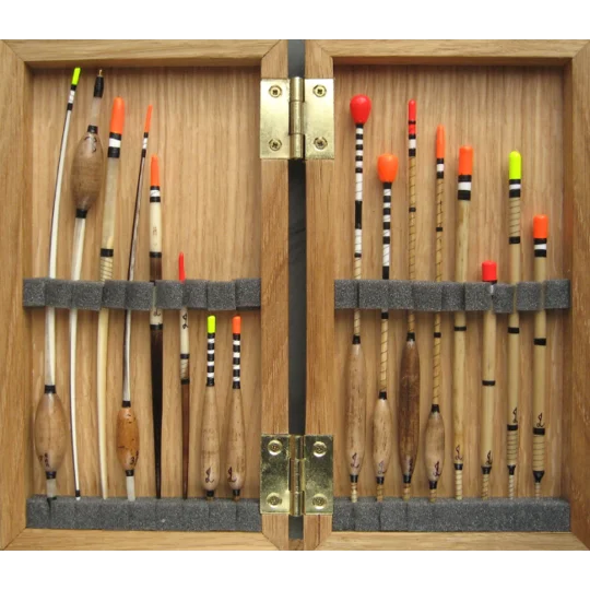 Oak float box with foam strips holding traditional fishing floats