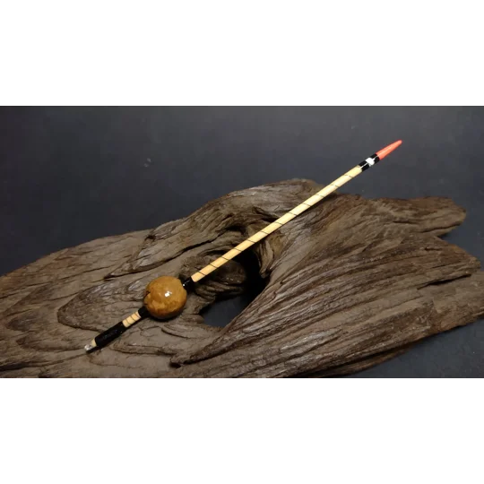 handmade oak gall waggler float on display log