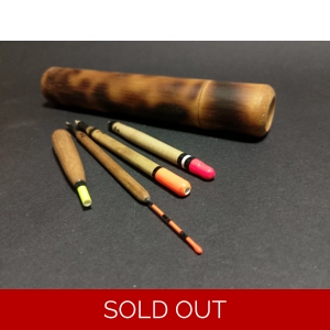 flame scorched bamboo tube with four handmade fishing floats