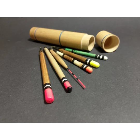 set of six handmade fishing floats in a bamboo tube with whipped decoration