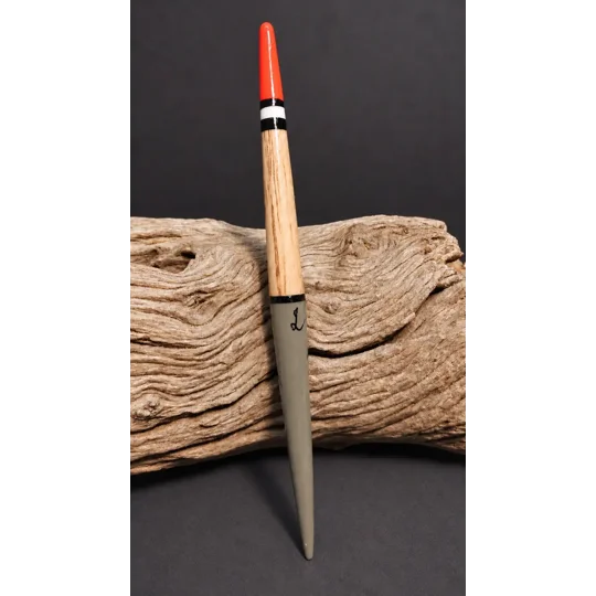 handmade balsa zeplin replica float displayed on driftwood