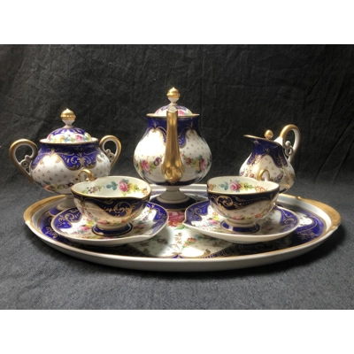 A wonderful porcelain tête-à-tête "Marquise de Sevigne", entirely hand-painted, produced by the Goum