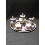 A wonderful porcelain tête-à-tête "Marquise de Sevigne", entirely hand-painted, produced by the Goum