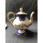 A wonderful porcelain tête-à-tête "Marquise de Sevigne", entirely hand-painted, produced by the Goum