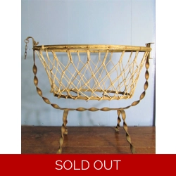 Antique French wrought iron and cotton mesh doll cradle.C1..