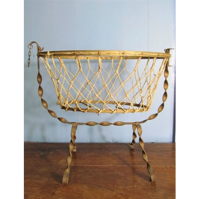 Antique French wrought iron and cotton mesh doll cradle.C1920